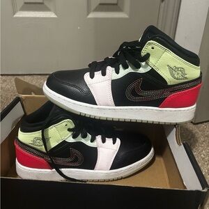 Black and Red Sneakers with Green Accents